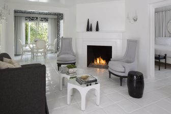 Room with fireplace, chairs and table