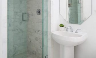 Bathroom showing sink, mirror and shower