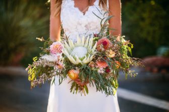 Closeup of bride holding flower bouquet