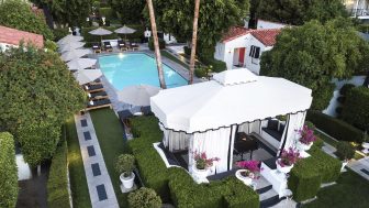 Overhead view of gazebo and pool area, surrounded by umbrellas and trees